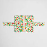 Tapis_langer_nomade_Nid_d_pli_rabats_ouverts_motif_fruits 