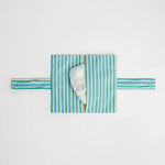 nide-tapis-langer-nomade-carreaux-ouvert-avec-couche 