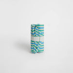 nide-tapis-langer-nomade-carreaux-roule 